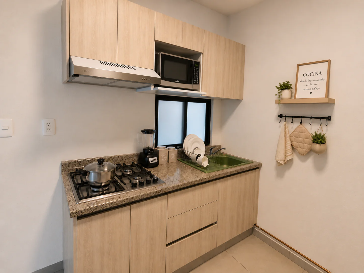 Cocina del departamento muestra de Idílica Del Parque
